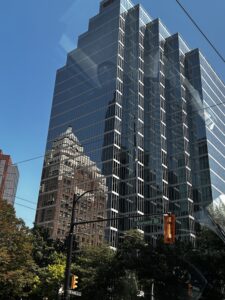 High rise office building against blue sky